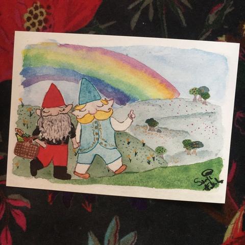 Art print of a watercolour painting of two gnome husbands hiking through the hills on the way to a picnic spot under a rainbow.