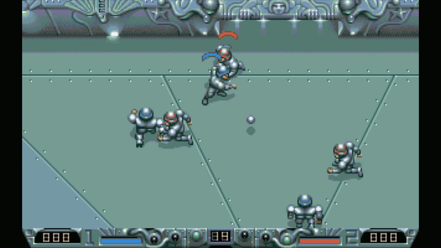 Scene from a Speedball match: the players - wearing protective gear and helmets - hunt for the steel ball to score a goal while fighting each other fiercely.