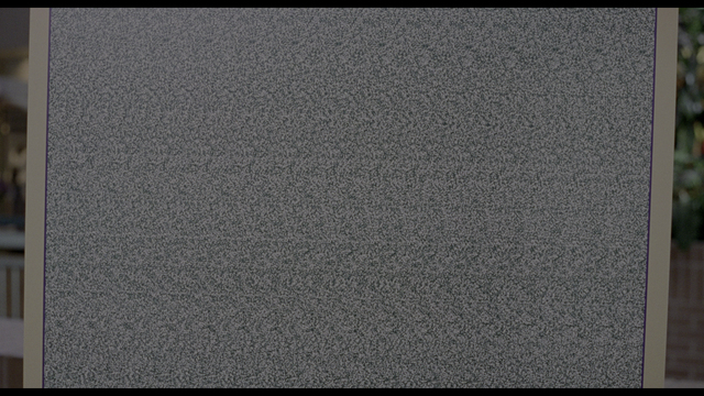 Still from the movie Mallrats. Nearly entire image is of a "magic eye" poster.
Staring at the poster and relaxing ones eyes reveals a series of geometric shapes in several rows. In the movie, they say it should be a sailboat, but it isn't.