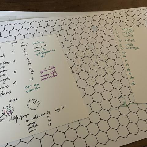 A hex grid map with accompanying colorful symbolic keys.