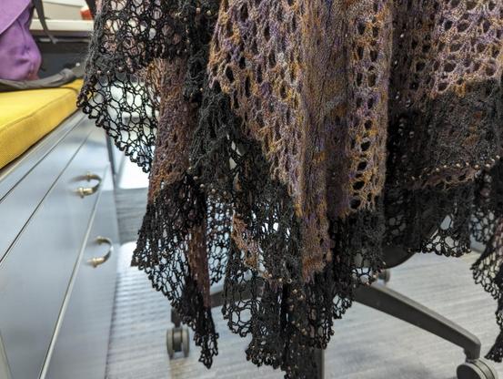 A closer shot to try to show the lace edging. It's quite open with many small beads all along the very edge.