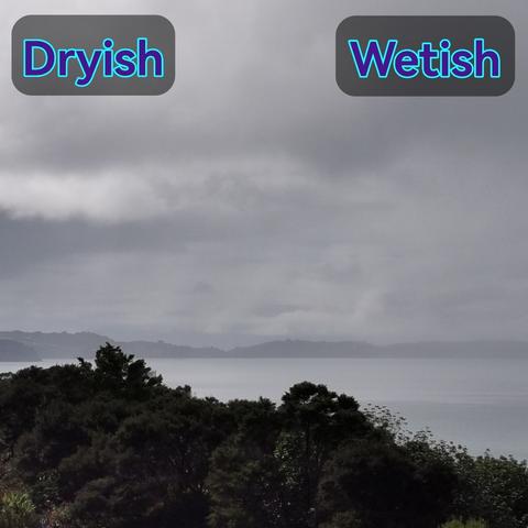 Overcast sky over land and sea, with reason falling on the right