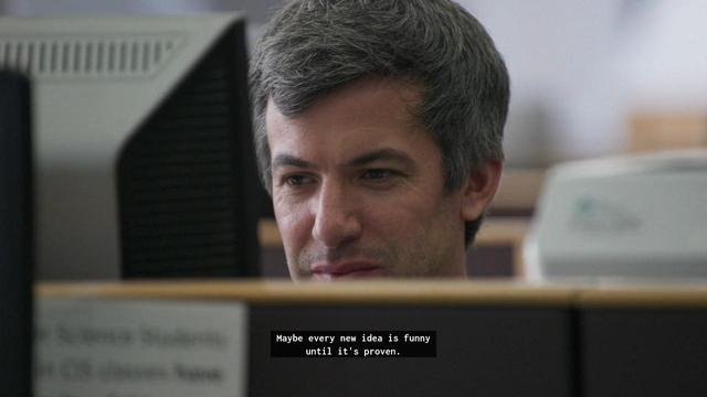 Nathan looking at media at a library computed saying : maybe every new idea is funny until it's proven