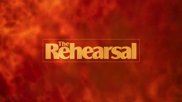 The Rehearsal logo in yellow with a background a explosive orange fire in the background