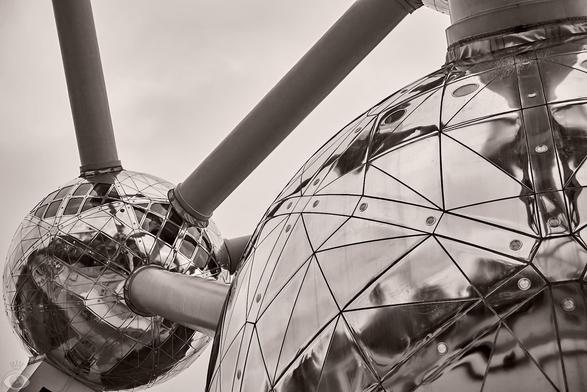 All three images are details of the Atomium: 9 gigantic (18m diameter) Stainless steel clad spheres joined together with steel tubes (which hold the escalators and elevators) shaped together in unit cell that represent an iron crystal, magnified 165 million times.
