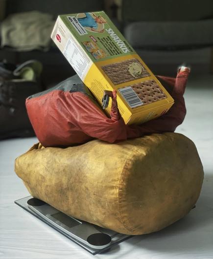 Photo of food supplies for a two-month hike, weighing 11.1 kg, with additional items not pictured.