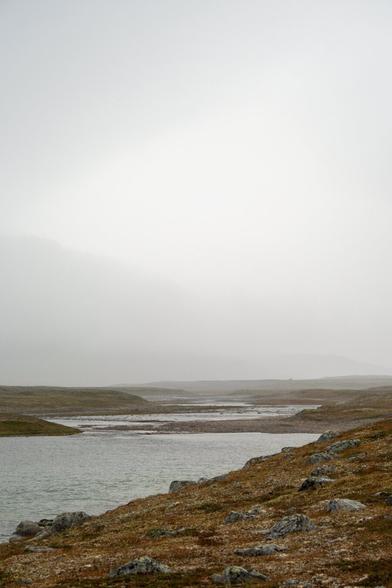 Photo of the misty Storelva river in Norway, taken during a hike in August 2023, showcasing the challenge of crossing the river.