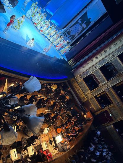 Conductor Elia Andrea Corazza in the orchestra pit conducting L'Elisir d'amore by Gaetano Donizetti. Teatro Massimo, Palermo, Sicily, Italy.