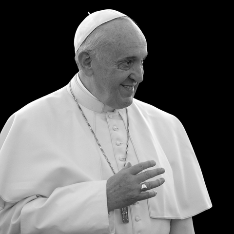 A photo of Pope Francis on a black background.
