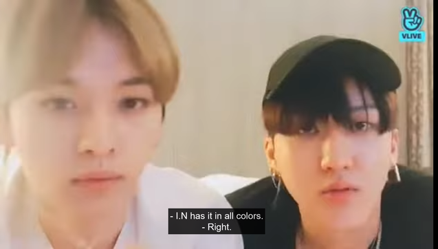 Lee Know and Changbin on a livestream. Lee Know says, "I.N has it in all colors."