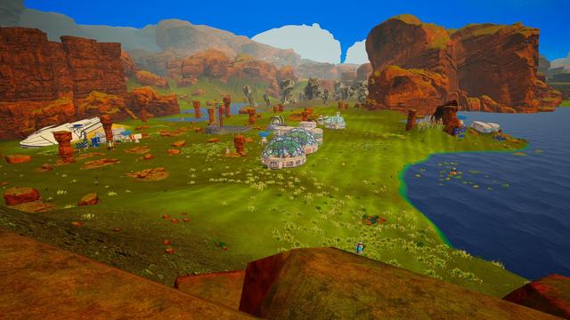 Blick von oben auf die Hauptbasis in The Planet Crafter mit umgebendem Grün und Seen.