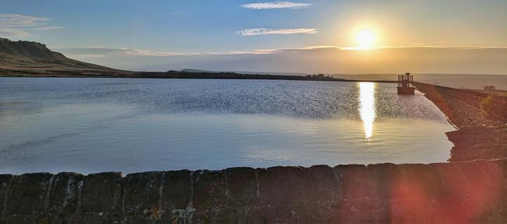 Low sun reflecting in a reservoir