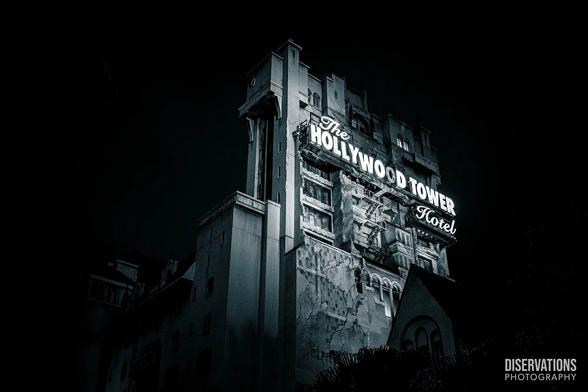 A black-and-white Tower of Terror as seen from Rock 'n' Roller Coaster