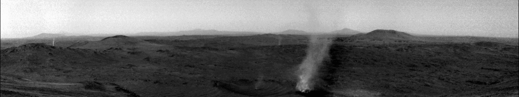 Black and white video illustrating a small Martian dust devil catching up to and getting swallowed up by a larger dust devil.