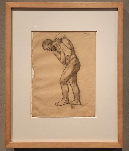 sketch of side view of nude, bearded man carrying a sack.