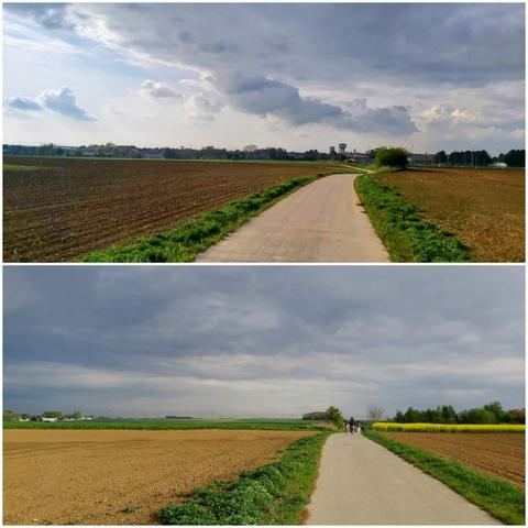 Supra bildo: Malplena kampara vojo serpentumas tra plugita kampo sub drama, parte nuboplena ĉielo sude al Arras en norda Francio. Videblas malproksime la urbo de Arras kaj akvoturo ĉe la horizonto.

Malsupra bildo: Sama vojo tra biena pejzaĝo sude al Arras, kun kampoj ambaŭflanke kaj kelkaj homoj promenantaj en la distanco. La ĉielo estas tute kovrita de densaj nuboj.
