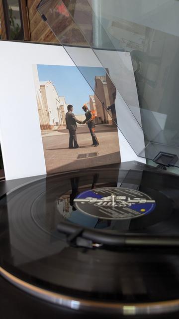 Pink Floyd's Wish You Were Here album cover next to the LP playing on a Sony Turn Table.