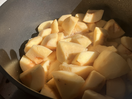 Chunks of quince softening on the pot
