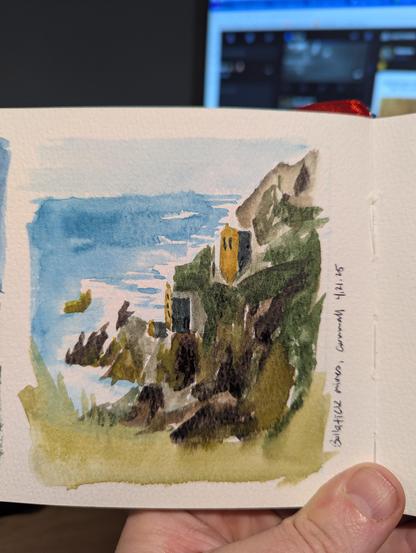 A seascape. The ocean washes up against sheer cliffs. Two buildings are just visible on the face. The label says "Bollatick Mines, Cornwall," which is wrong. It's Botallack Mines in Cornwall.