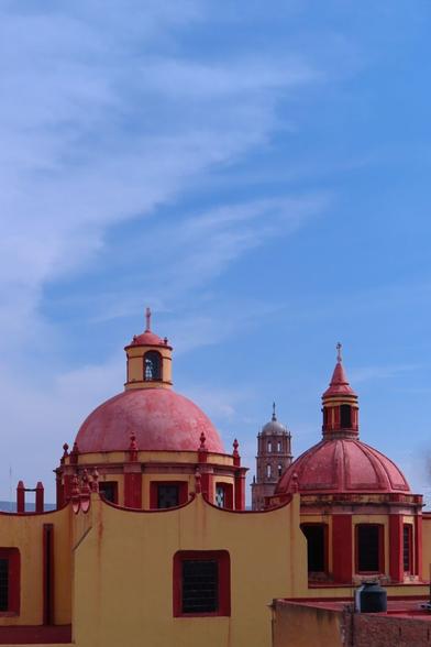 The dome of a church and a blue sky in Queretaro Mexico