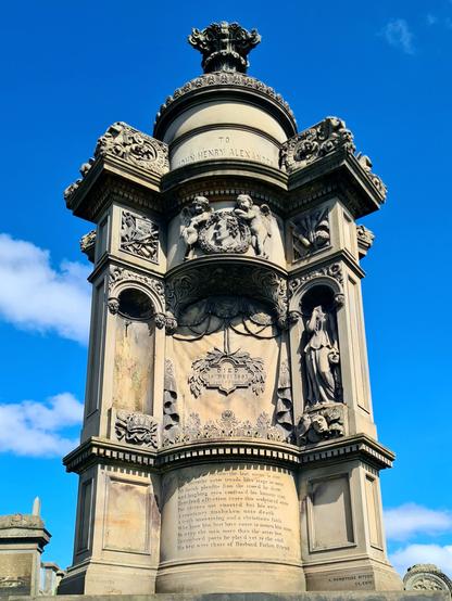 An ornate, theatre-themed grave memorial in the Glasgow Necropolie.