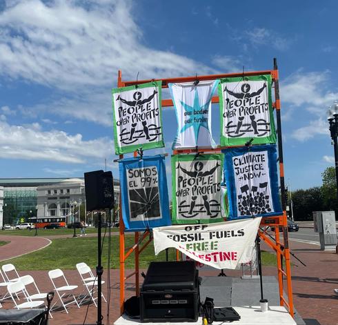 Photo of solidarity city stage from side with hanging signs