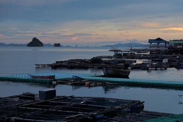 village docks in sunset. islands in the rear view