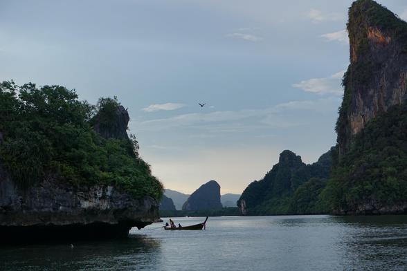 a fishing boat travelling between islands