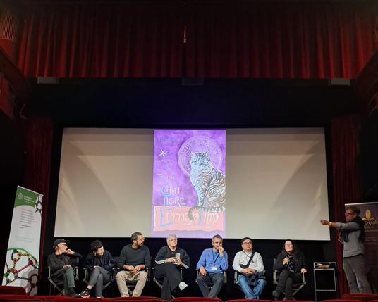 Q&A of film directors after screening, there are 7 filmmakers and one moderator. Photo by Yuri Prado.