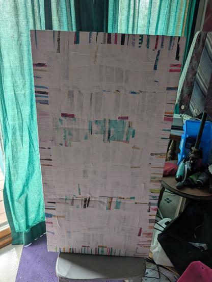 Back of the shelving, covered in paper.