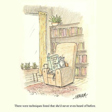 A cartoon illustration of a surprised cat reading a book titled "Pushing Crap Off Tables." Caption reads "There were techniques listed that she'd never even heard of before."