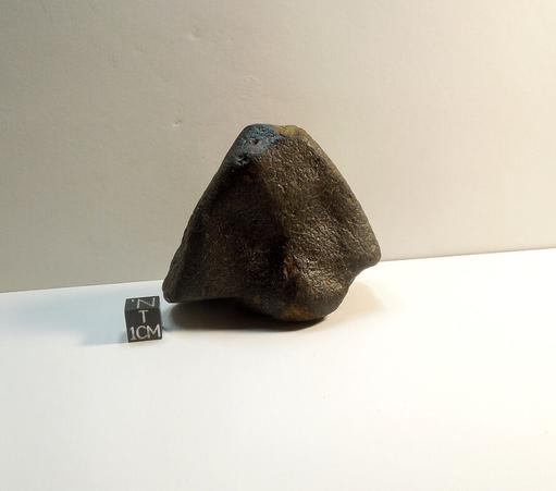 Unclassified NWA meteorite with fusion crust.