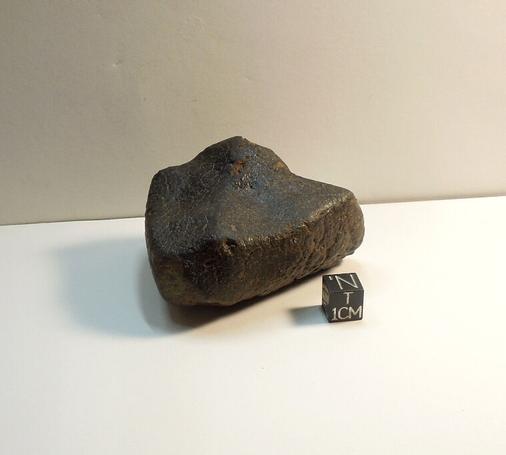Unclassified NWA meteorite with fusion crust.