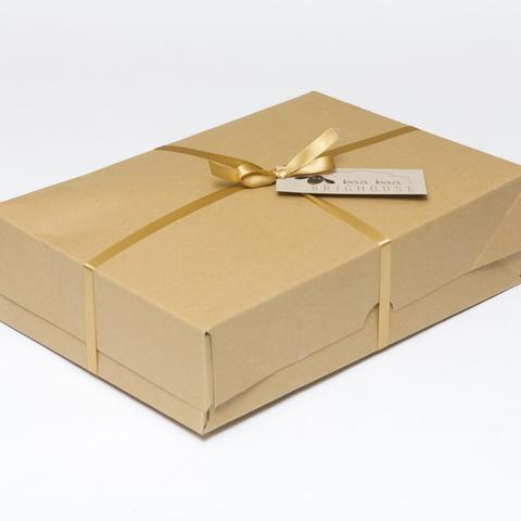 Picture shows a closed A4 box tied with gold ribbon.