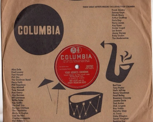 A Columbia 78RPM record sleeve, featuring graphics of a drum, symbols and a saxophone. The word “Columbia” appears in a black circle at the top left of the record sleeve.