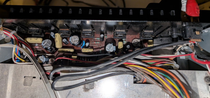 The PSU after recapping. On the back, there are 5 voltage regulators bolted to a massive heat sink.