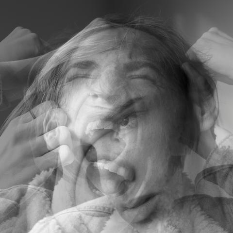 Double exposure of a woman screaming with her hands clutching her head—visually capturing the emotional stress and internal pressure writers feel during the creative process.