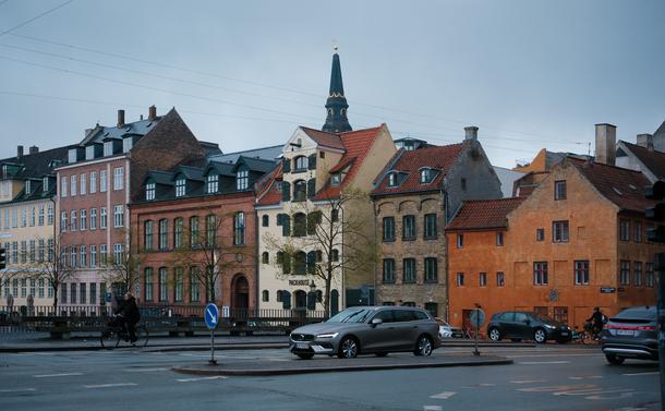 cityscape with colorful houses and gray cars in the rain, Copenhagen
