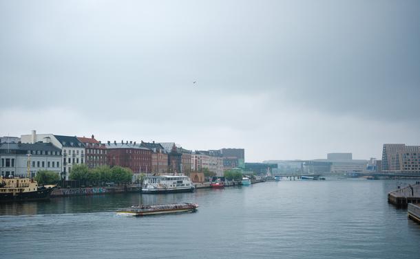 Copenhagen harbour under dense gray clouds