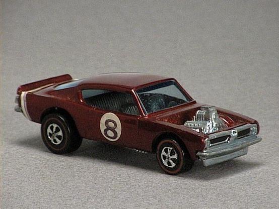 Released in 1970, Spectraflame Brown King 'Kuda of 1970 Spoilers with Redline wheels. Packaging: Spoilers. Metal Body, Metal Base. Made in Hong Kong. Scarcity: 7/10