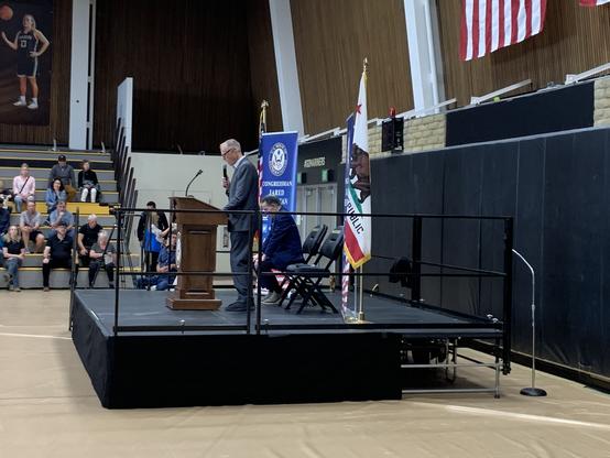 Rep Jared Huffman at the podium opening the proceedings