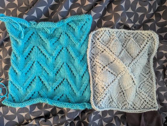 A photo of two knit squares. The left square is in a teal yarn with a chevron lace pattern. The right square is in a sky blue yarn in a diamond lace pattern.