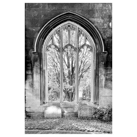 Black and white photograph of a church window that was destroyed by bombing in the WWII blitz.