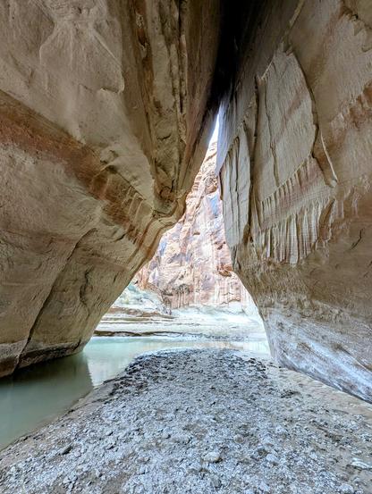 Looking through a natural tunnel that dwarfs my hiking companions