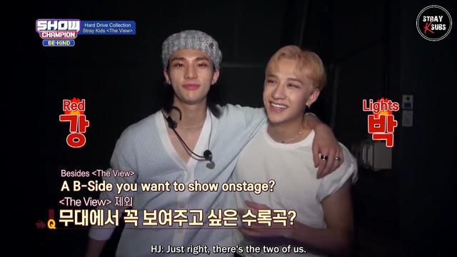 Hyunjin with his arm around Bang Chan's shoulders. Text overlaid includes: "Red Lights" "Besides <The View>, a b-side that you want to show onstage?"