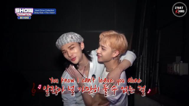 Hyunjin has his arm around Bang Chan's shoulder. Chan has been caressing Hyunjin's chest and is getting closer to his neck. Caption: "You know I can't leave you alone"