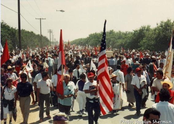 Photo of Cesar Chavez's funeral procession with thousands of people