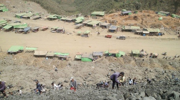 Remains of the Hpakant miners’ shanty town after 2020 landslide.