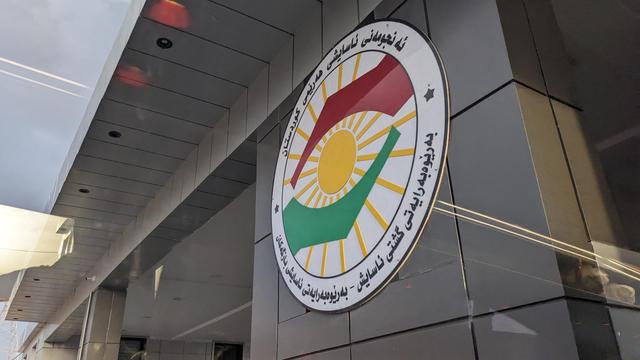 The Kurdish hands emblem on a highway.