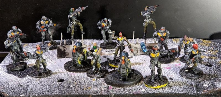 28 mm sci-fi miniatures for Mantic firefight, some robot looking armoured marines and less armoured scouts, with two monocycles